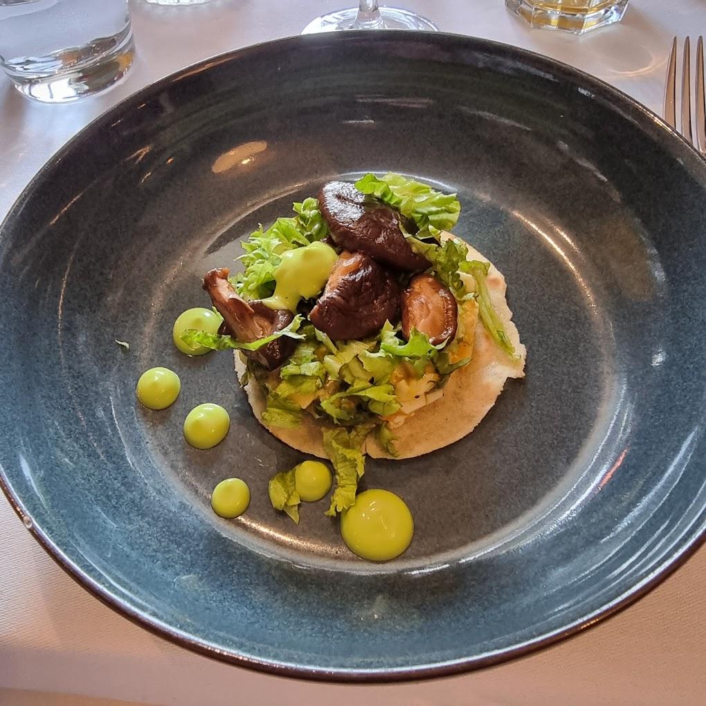 A plate of food on a table

AI-generated content may be incorrect.