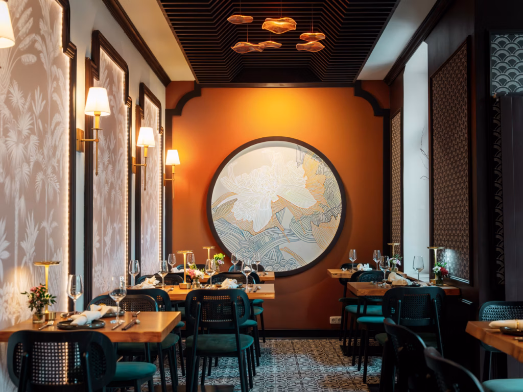 A restaurant with tables and chairsAI-generated content may be incorrect.